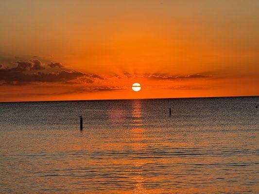 Sunset outside beautiful clean beach great drinks and food and the sunset not edited speaks volume