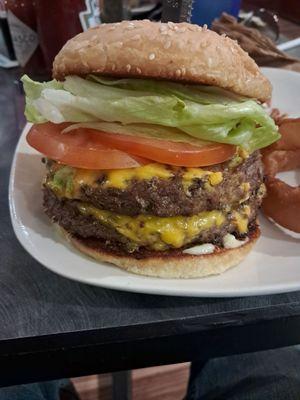 A lot of quality meat & fresh veggies in between toasted sesame seed buns make up this filling and delicious double cheeseburger.