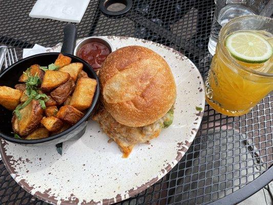 Carnitas torta with patatas bravas. Passion fruit margarita pictured at right.