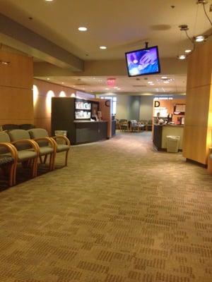 One of the waiting rooms. Clean, neat, TVs and magazines. Typical office.