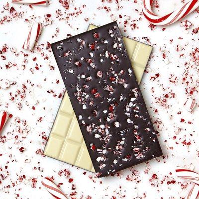 Peppermint Bar! White Chocolate, Dark chocolate flavored with peppermint and topped with crushed candy cane pieces.