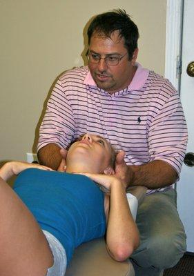 Dr. Berkman working with a patient