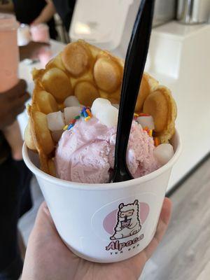 Bubble waffle with strawberry ice cream mochi and sprinkles