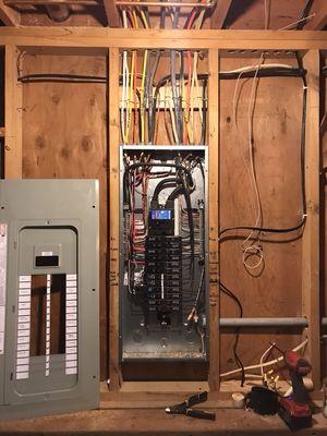 New Panel after removing and replacing old outdated panel that had no main breaker and no extra spaces.