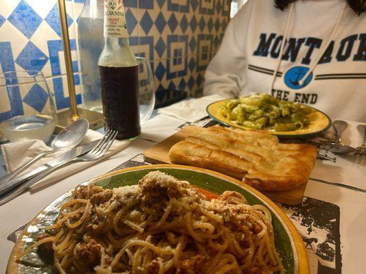 Spaghetti with pastiamo ragu (bottom), Focaccia (middle), and Elicoidali with pesto sauce (top)