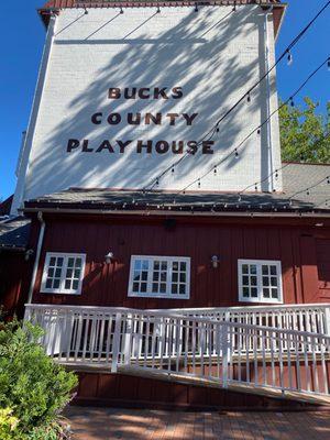 From the front patio, you're seated outside the Playhouse while waiting for a table on The Deck