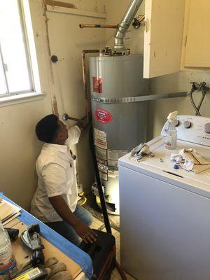 Apprentice plumber Bryan working on a new water heater install. Call 707-544-6444 for all your water heater needs!