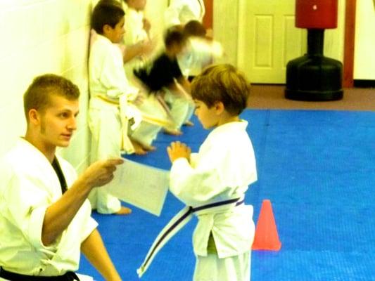 Karate Kids have their own ranking system; their goal is to earn a black uniform to train with the older students.