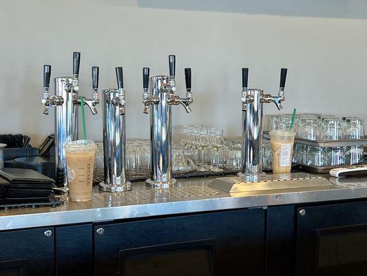 The newly built bar area with taps waiting to be hooked up was surrounded by Starbucks drinks from the servers. 1/5 not sanitary