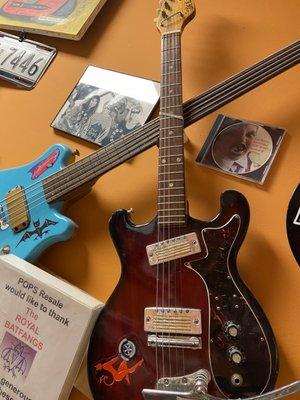 Guitars and Decor on walls at Pop's Resale