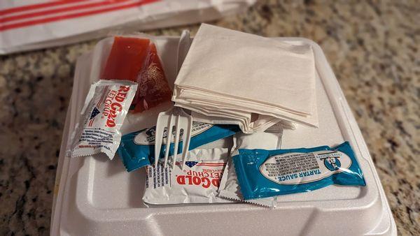 Pretty standard setup: ketchup, hit sauce, tartar sauce, napkins and fork