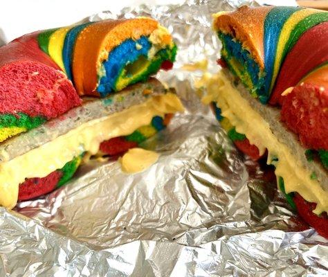 Rainbow egg, sausage, and cheese bagel