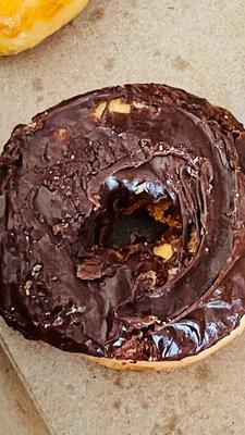 Chocolate donuts that look like my 16-month-old granddaughter decorated them.