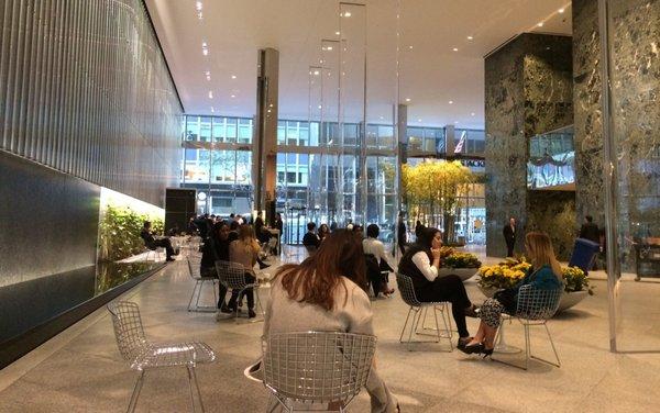 Plaza with wall waterfall & Starbucks