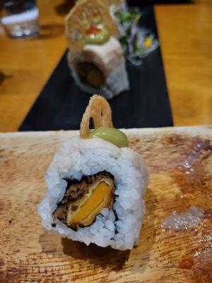 Manila Dune sushi roll: tempura pumpkin, spicy burdock, shredded tofu, avocado, chili, and reckon. Delicious.