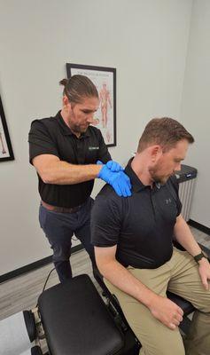 Dr John Maloney, DC - Chiropractor treating for neck pain and spasms