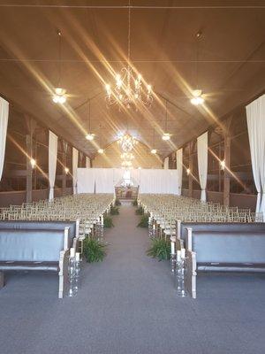 View of indoor ceremony hall from stage. Great lighting looking into audience