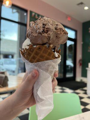 Chocolate Amaretto Cheesecake and Cookie Monster ice cream in a waffle cone