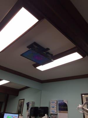 TV on the ceiling for you to watch during treatment!