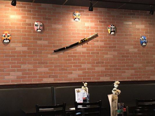 Upside-down sword on the wall. Not a Tachi.