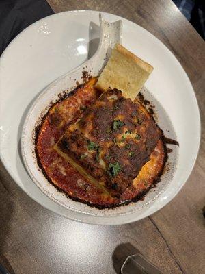 Similar to lasagna but slightly on the dry side.