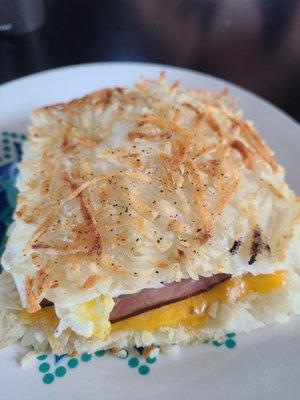 Hash brown sandwich with ham.