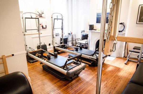 Our private Pilates room equipped with reformers towers, a cadillac and wunda chairs.