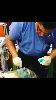 Doctor Mukerji performing an obagi blue peel. Used to rejuvenate skin and treats blemishes, acne, lines, and uneven skin tone