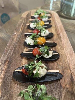 Tomatoes and baby mozzarella with micro greens and fig glaze