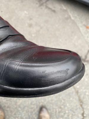 Smudge of glue, and he said they shoes were polished when questioned directly about this issue. That is a lie.