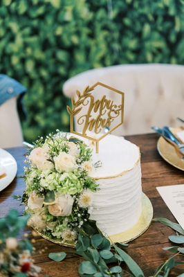 Cake he made for us to cut at the wedding. Decorated with flowers that matched the colors I told him