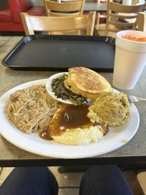 Turkey and gravy, mustard greens, mashed taters and gravy, dressing and bread.