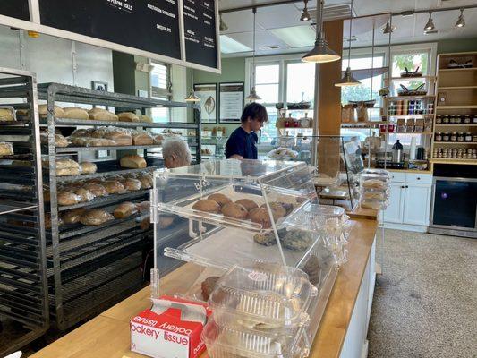 Front ordering counter with fresh baked bread selections on open racks - THAT fresh. The place smells amazing, the staff is so nice