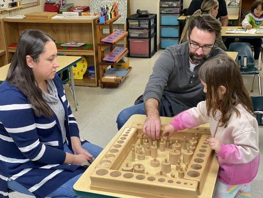 Primary student showing parents the shape recognition games she uses in class.