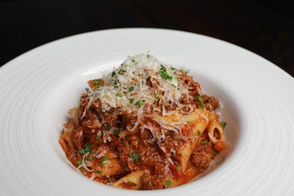 Savory Bolognese Pasta topped with shredded Parmesan!