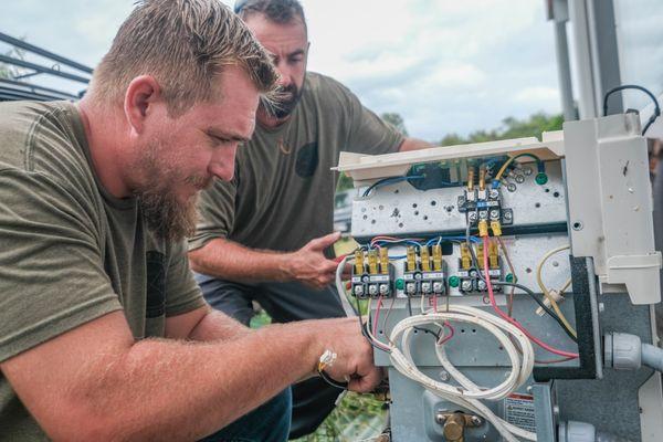 Doctor HVAC's specialized HVAC technicians diagnose a faulty condenser that is part of a mini-split AC system.