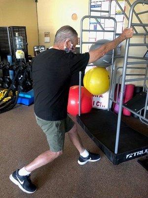 Shoulder prehab exercise on True Stretch equipment