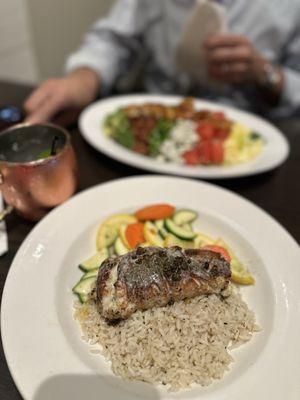 Front: Shrimp & crab stuffed blackened flounder with a side of seasoned rice and sauté squash.  Back: shrimp Cobb salad.