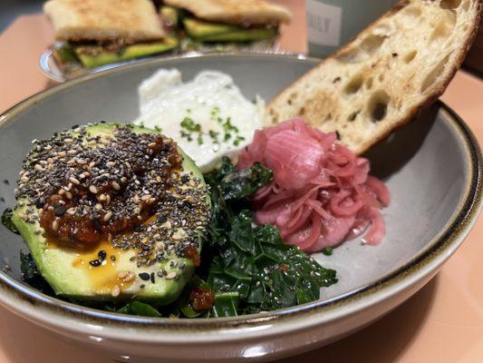 Loaded Avocado Vegetarian . Half Avocado, Over Easy Egg, Fennel Chili Crisp, Market Greens, Pickled Onion, Chives, toast - 11