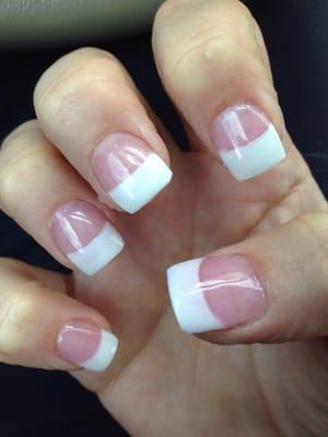 Uneven and blurry lines, clunky shape to the nails and uneven coverage of white.  Truly disappointing.