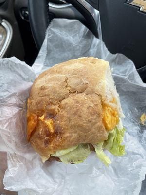 Biscuit with cheese, lettuce, bacon, and chicken