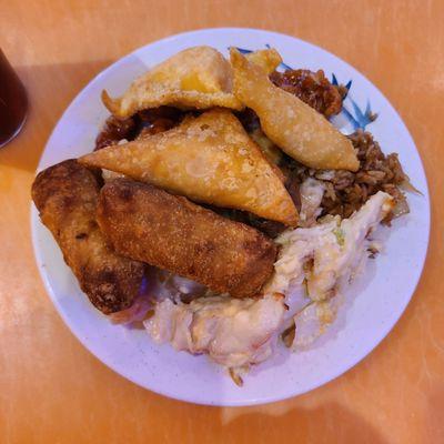 Crab rangoon, egg rolls, cheesy crab casserole, honey chicken, and shrimp in a sweet mayo sauce.