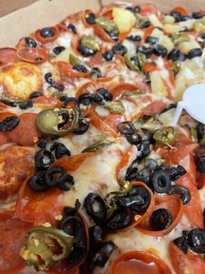 Pepperoni, olives, and jalapeños.