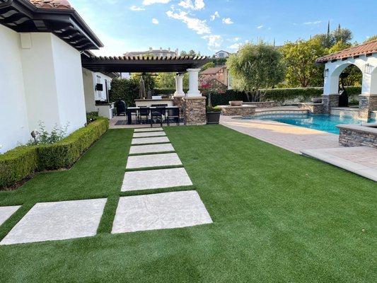 Natural-look turf transformation in this lovely backyard