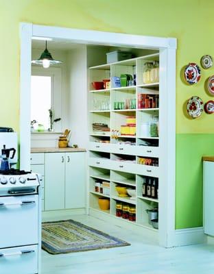 Pantry in white with open shelving creates a sleek, organized look while also being efficient