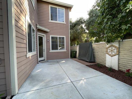 Clean area with removed gazebo and a deck for ping pong table.