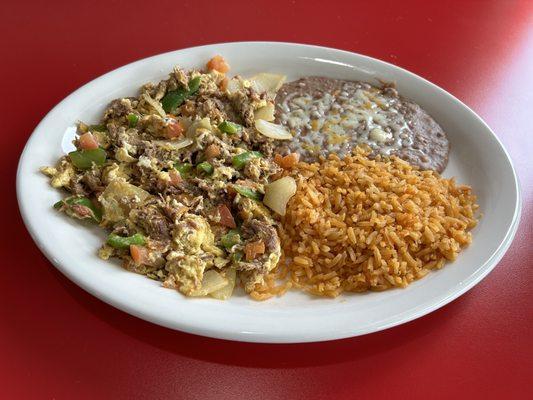 Breakfast Machaca. Shredded beef mixed with eggs, onion, tomato and bell pepper.