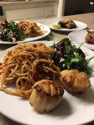 Puttanesca, scallops, and salad. Obsessed with this meal!!