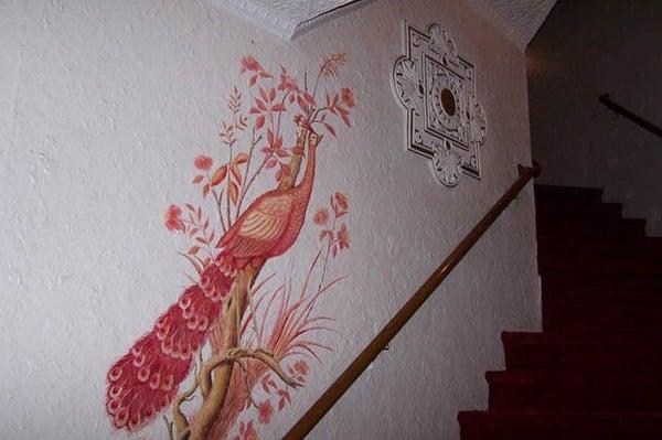 art deco peacock on stairway wall