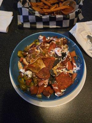 Nachos in a cereal bowl...stale...cold on one side slightly warm on the other...thanks but never again.